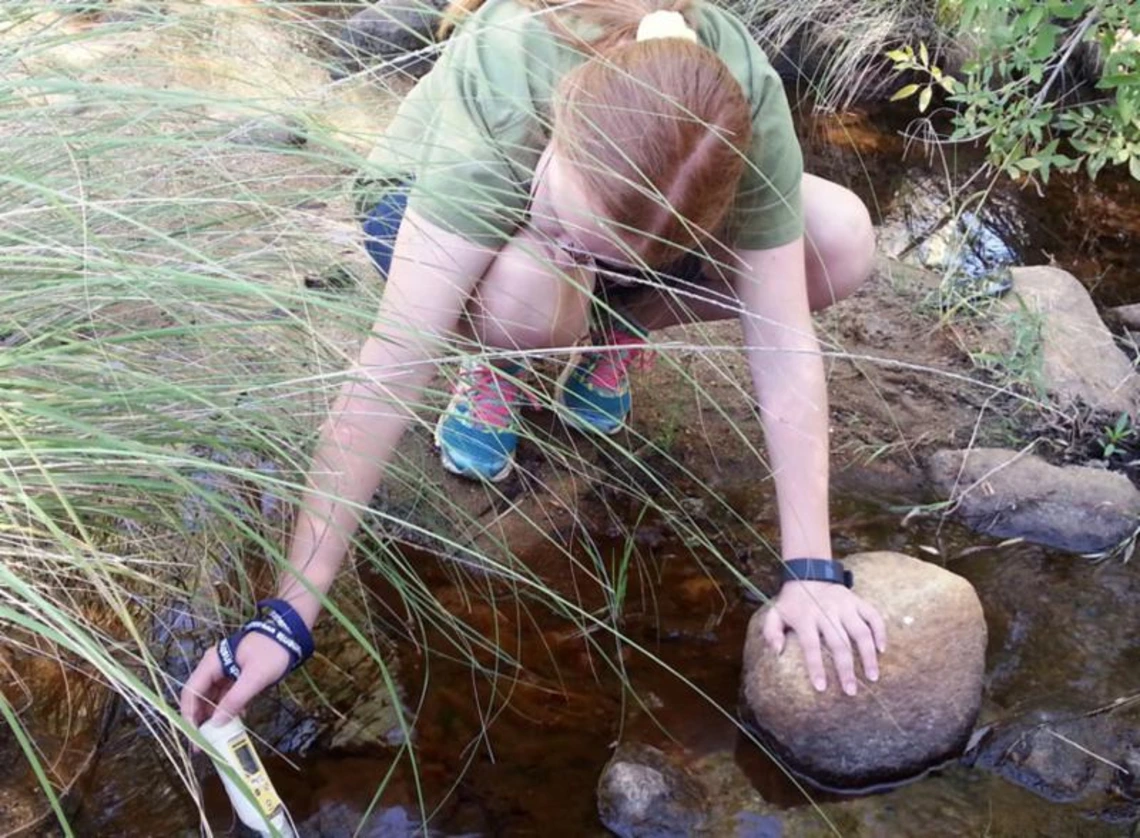 Sparking Interest in Science Investigations girl next to stream