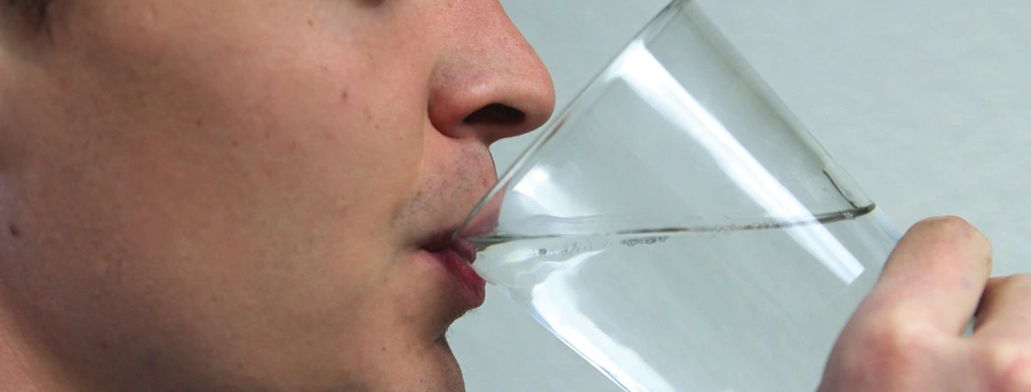 Potable Reuse of Water random guy drinking water out of a glass