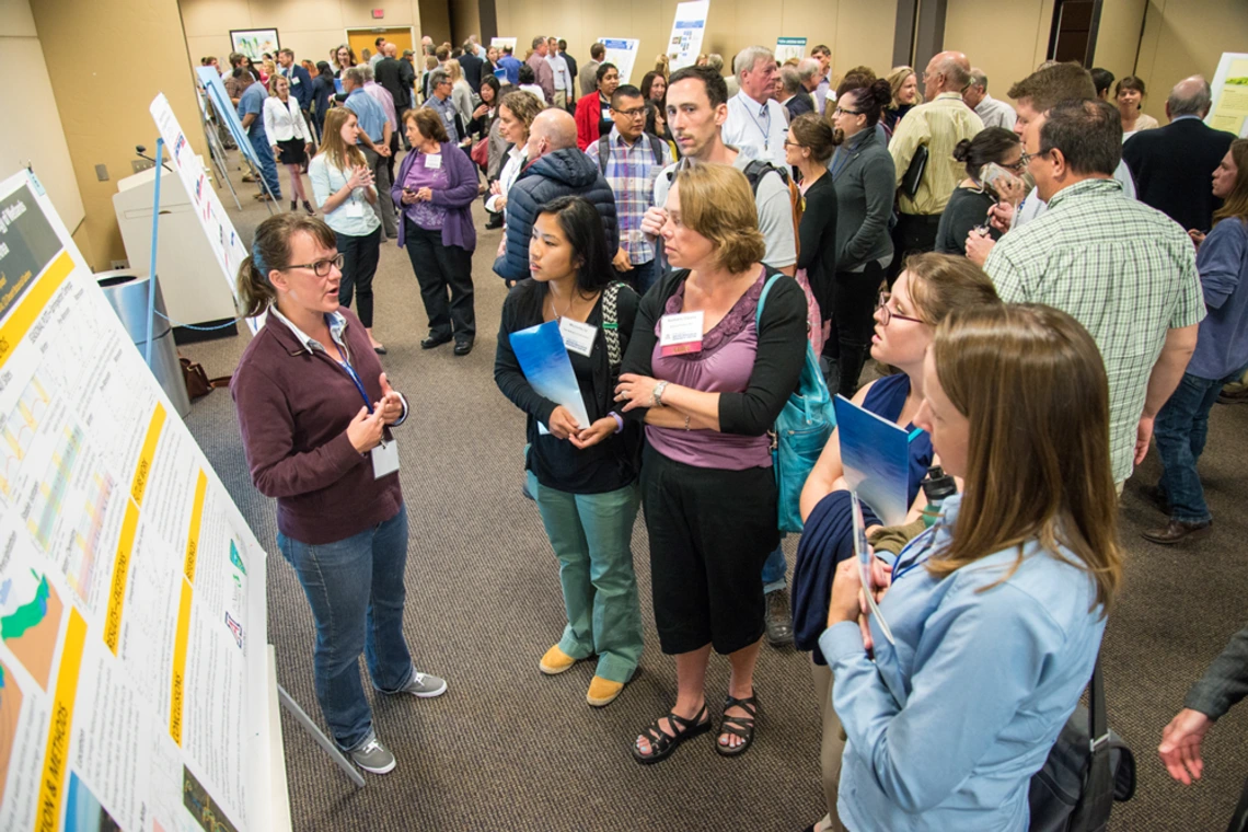 Poster Session Presents Engaging Opportunity for Students Student describing poster
