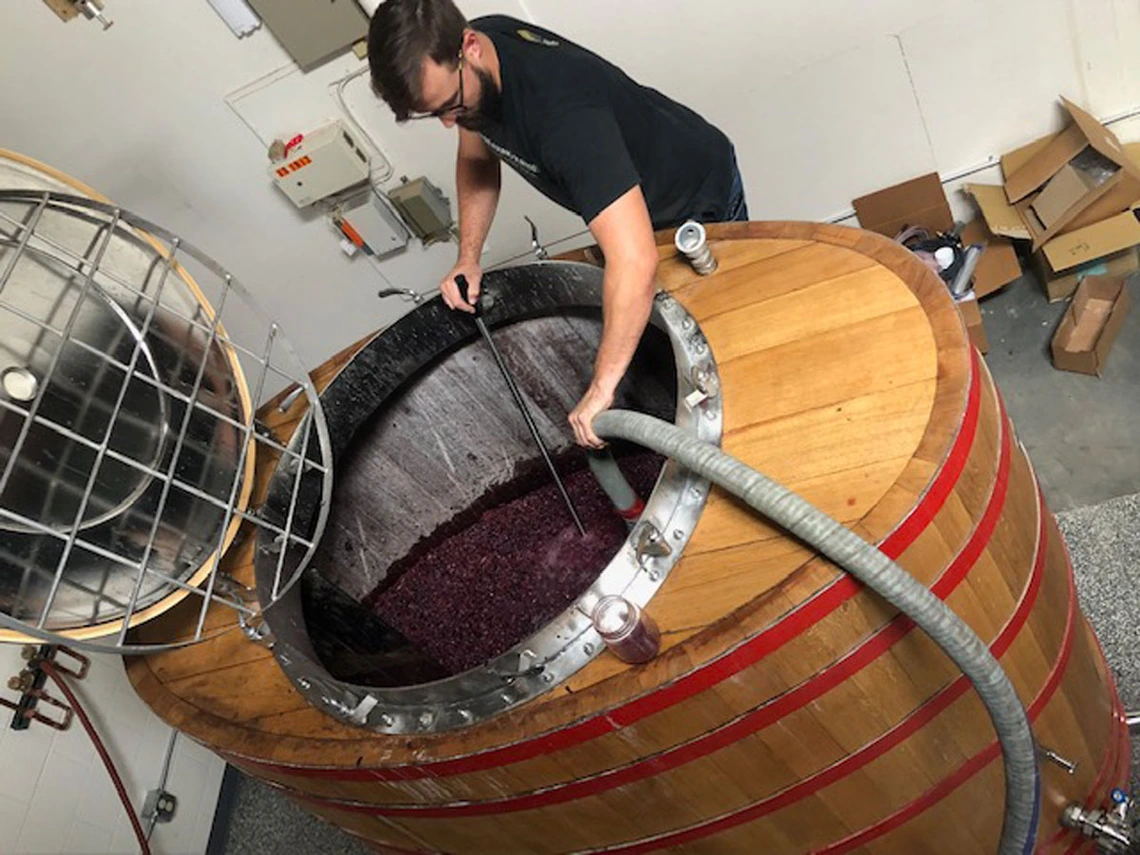 a man making beer a man making beer