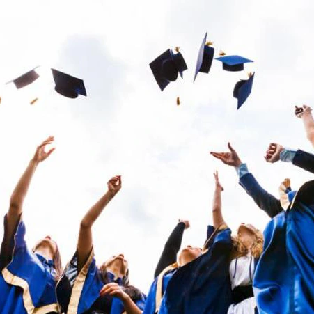 group of graduates throwing caps