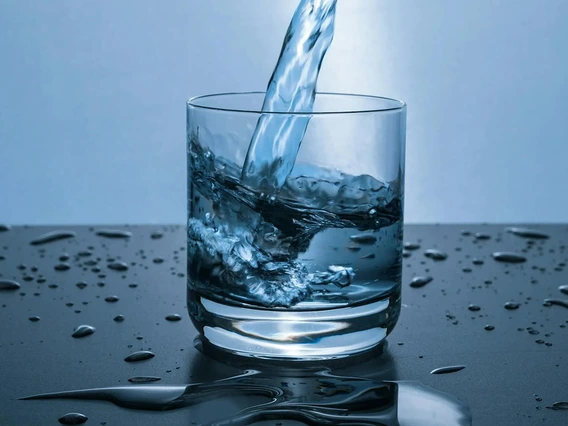 photo of water being poured into a glass