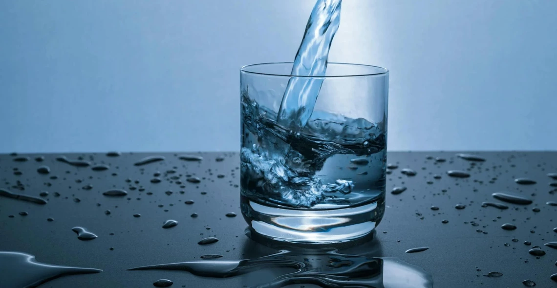 photo of water being poured into a glass