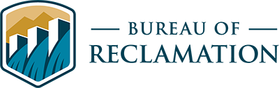 Bureau of Reclamation logo featuring a graphic of a dam and mountain