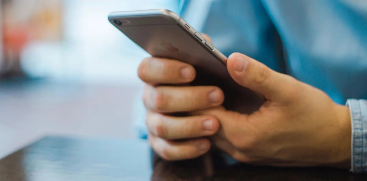 hands holding a smartphone hands holding a smartphone