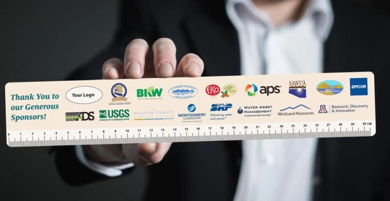 a hand holding a ruler with sponsor logos a hand holding a ruler with sponsor logos