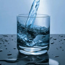 photo of water being poured into a glass